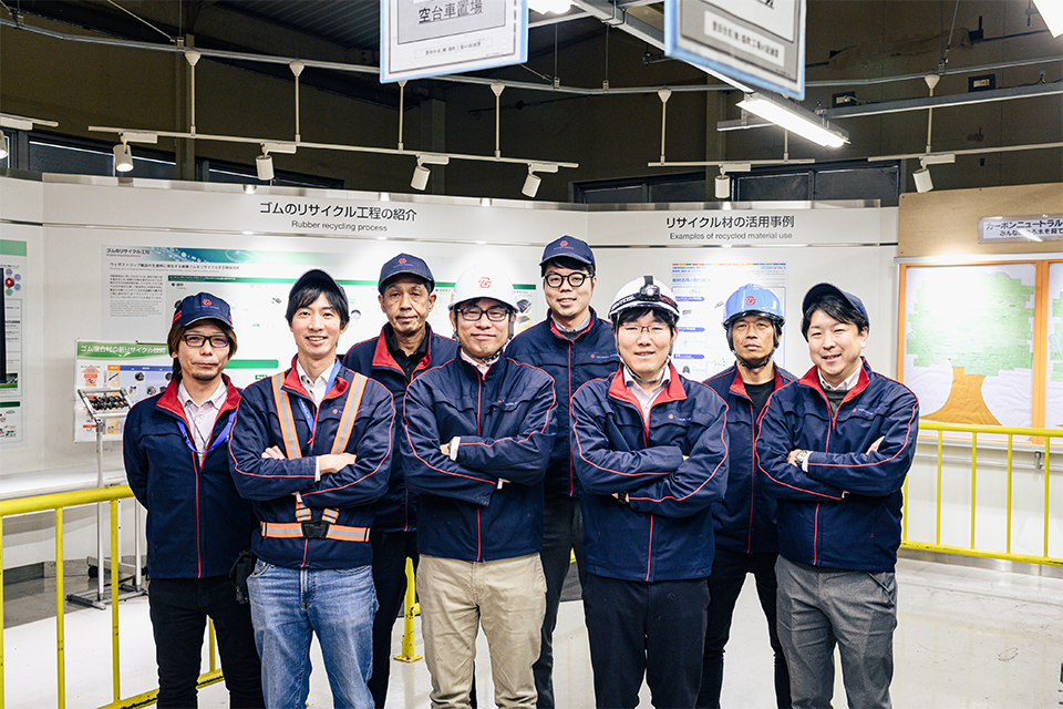Team members working with recycled rubber on a daily basis